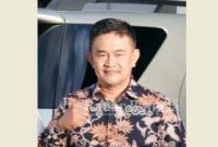 Kadis Kominfo Pasaman,  saat konfirmasi di ruang kerja (Foto : AH)