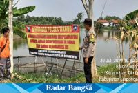 Polsek Tikung s himbauan serta pemasangan banner larangan bermain di waduk