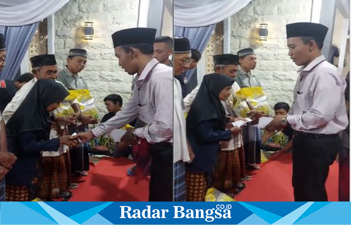 Penangunggjawab Kegiatan Zainul Arifin saat membagikan bantuan uang saku dari Ketua Umum Muslimat NU Khofifah Indar Parawansa  dan 50 paket beras kemasan 5 kg dari UD Tiga Saudara.(Dok foto panitia)