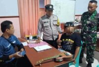 Nampak Polisi mengamankan Pelaku Penganiayaan. (RadarBangsa.co.id)