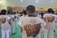 Atlet Tarung Derajat Kota Batu, Aprillisya, tampil gemilang saat mengalahkan lawannya dari Sidoarjo di kelas 40,1–45 kg putri dengan skor 3-0 pada Porprov IX Jatim 2025 yang digelar di Hotel Ciptaningati, Rabu (2/7/2025). | Dok Foto Ho/RadarBangsa