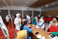 Sejumlah peserta dari berbagai organisasi perempuan mengikuti forum Rembuk Perempuan di Aula Minak Jingggo Kantor Pemkab Banyuwangi, Senin (29/9/2025). (Foto Dok Ho/RadarBangsa.co.id)
