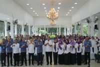 Bupati Asahan Taufik Zainal Abidin saat membuka Rapat Koordinasi Tim Pembina Posyandu Kabupaten Asahan Tahun 2025. (Foto Dok Ho/RadarBangsa.co.id)