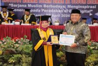 Bupati Asahan saat menghadiri wisuda IAIDU di Kisaran, Kamis (23/4/2026). (Foto Dok Ho/RadarBangsa.co.id)