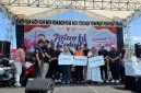 Penyerahan simbolis santunan BPJS Ketenagakerjaan pada peringatan May Day di Jember, Minggu (3/5/2026). (Foto Dok Ho/RadarBangsa.co.id)