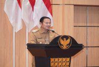 Bupati Lamongan Yuhronur Efendi menyampaikan sambutan dalam Rapat Paripurna DPRD Lamongan terkait persetujuan Raperda Pertanggungjawaban Pelaksanaan APBD Tahun Anggaran 2025, Senin (6/7/2026). (Foto Dok Ho/RadarBangsa.co.id)