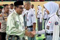 Sekretaris Daerah Kabupaten Pelalawan, Tengku Zulfan, membuka Pendidikan dan Pelatihan Paskibraka Kabupaten Pelalawan Tahun 2026 di GOR Tengku Pangeran, Pangkalan Kerinci, Kamis, 6 Agustus 2026. (Foto Dok Ho/RadarBangsa.co.id)